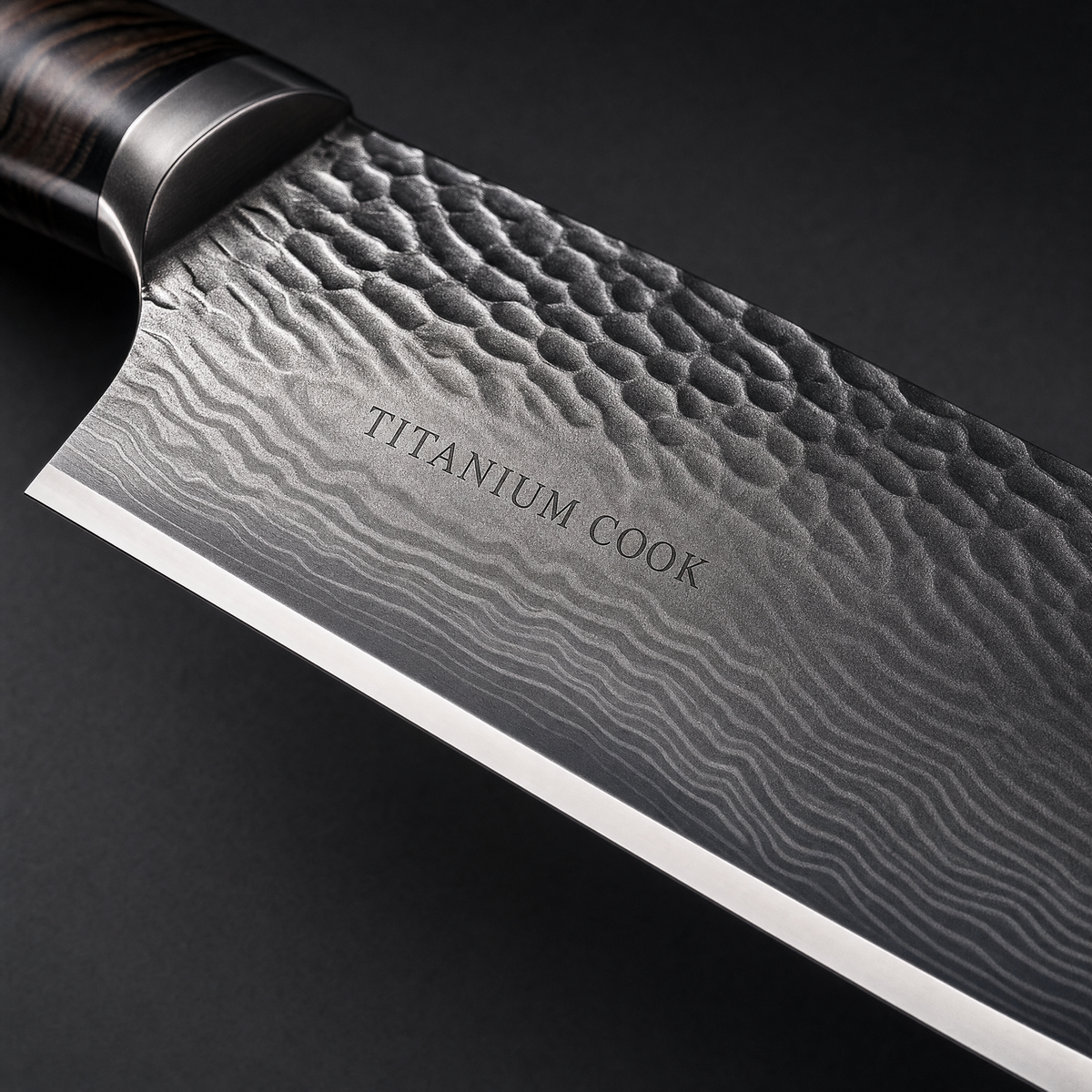 Detail of the engraved hammered TITANIUM COOK blade — Kiritsuke Nocturne