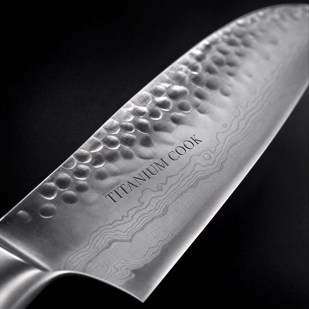 Detail of the engraved hammered blade TITANIUM COOK — Santoku Nocturne