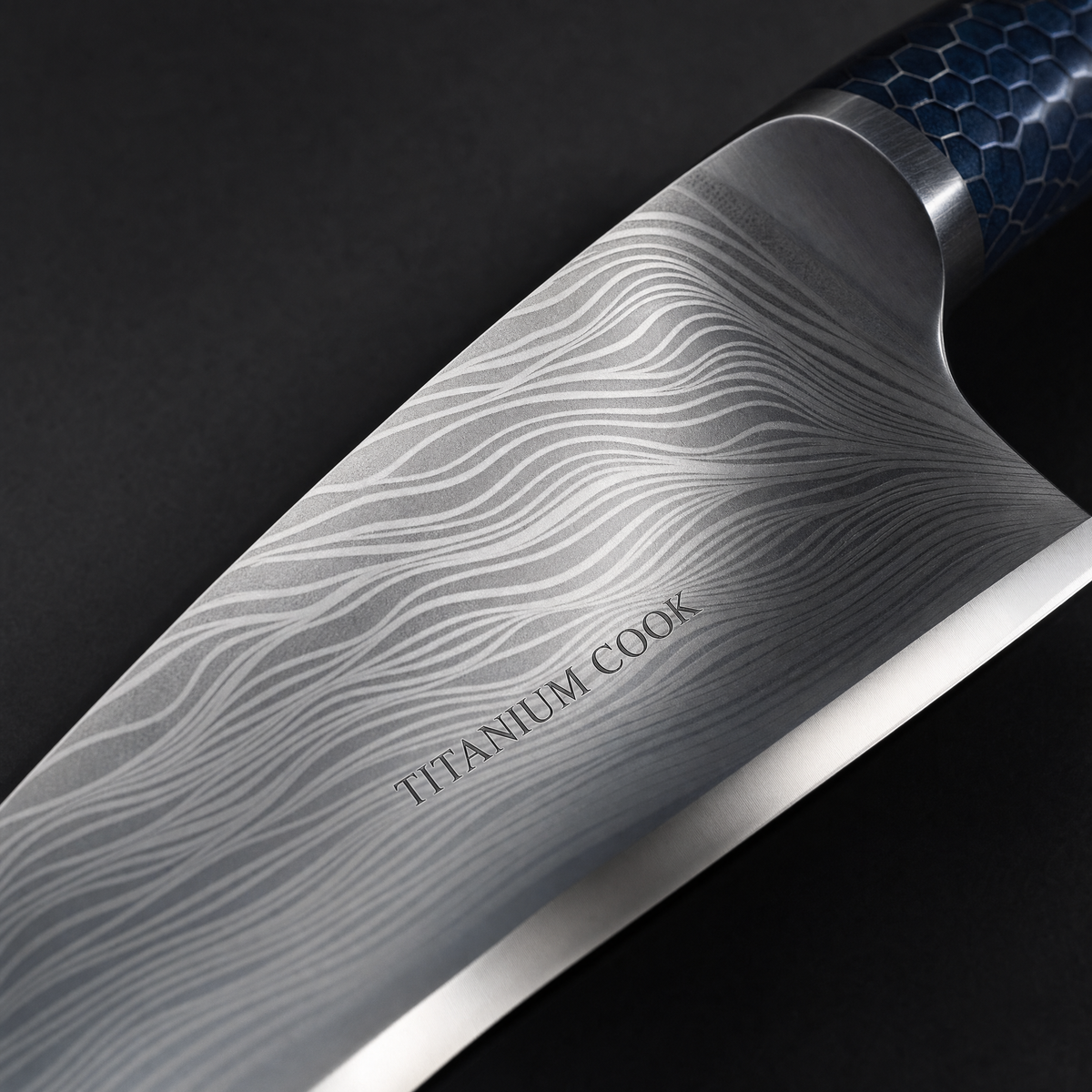 Close-up of engraved DAMASCUS blade TITANIUM COOK — Santoku with granton edge